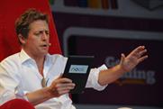 Hugh Grant reads for the crowds at the Get Reading Festival